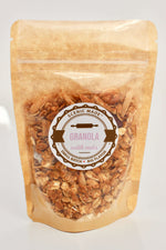 Crunchy granola with nuts and dried fruit. 2 ounces of granola, packed in a Kraft colored food safe bag with a clear front. Bag is resealable and has an attractive label on the front.