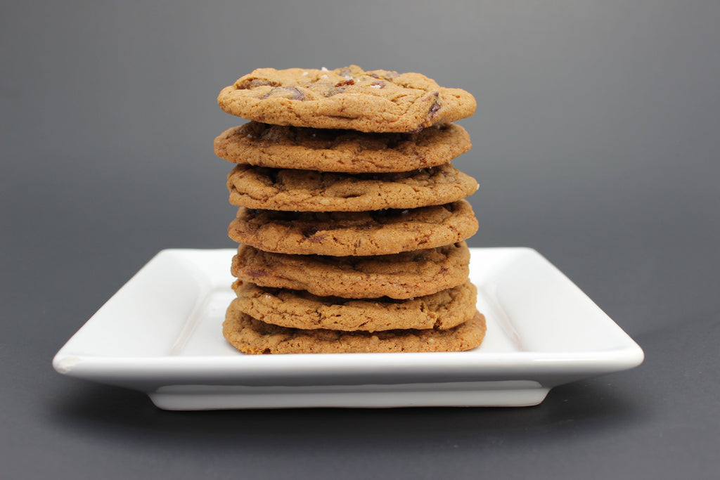  Stack of chocolate chip cookies in a cylinder with a cute Scenic Made label, includes the words chocolate chip cookies and small batch, big flavor.