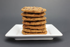  Stack of chocolate chip cookies in a cylinder with a cute Scenic Made label, includes the words chocolate chip cookies and small batch, big flavor.