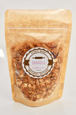 Crunchy granola with nuts and dried fruit. 2 ounces of granola, packed in a Kraft colored food safe bag with a clear front. Bag is resealable and has an attractive label on the front.