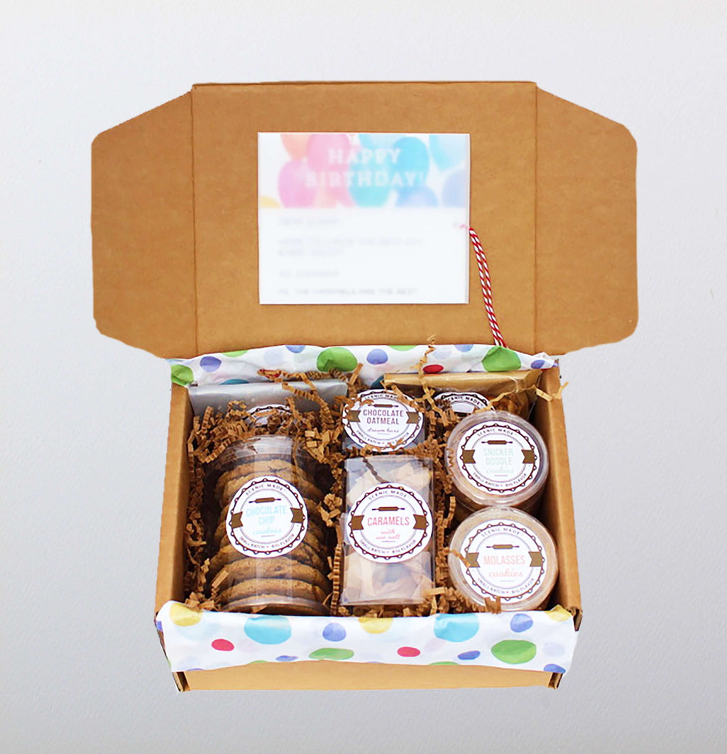 The birthday box includes chocolate chip cookies, molasses cookies, snickerdoodles, caramels. shortbread bites, chocolate oatmeal dream bars and granola in box with a personalized card. It's a party in a box!