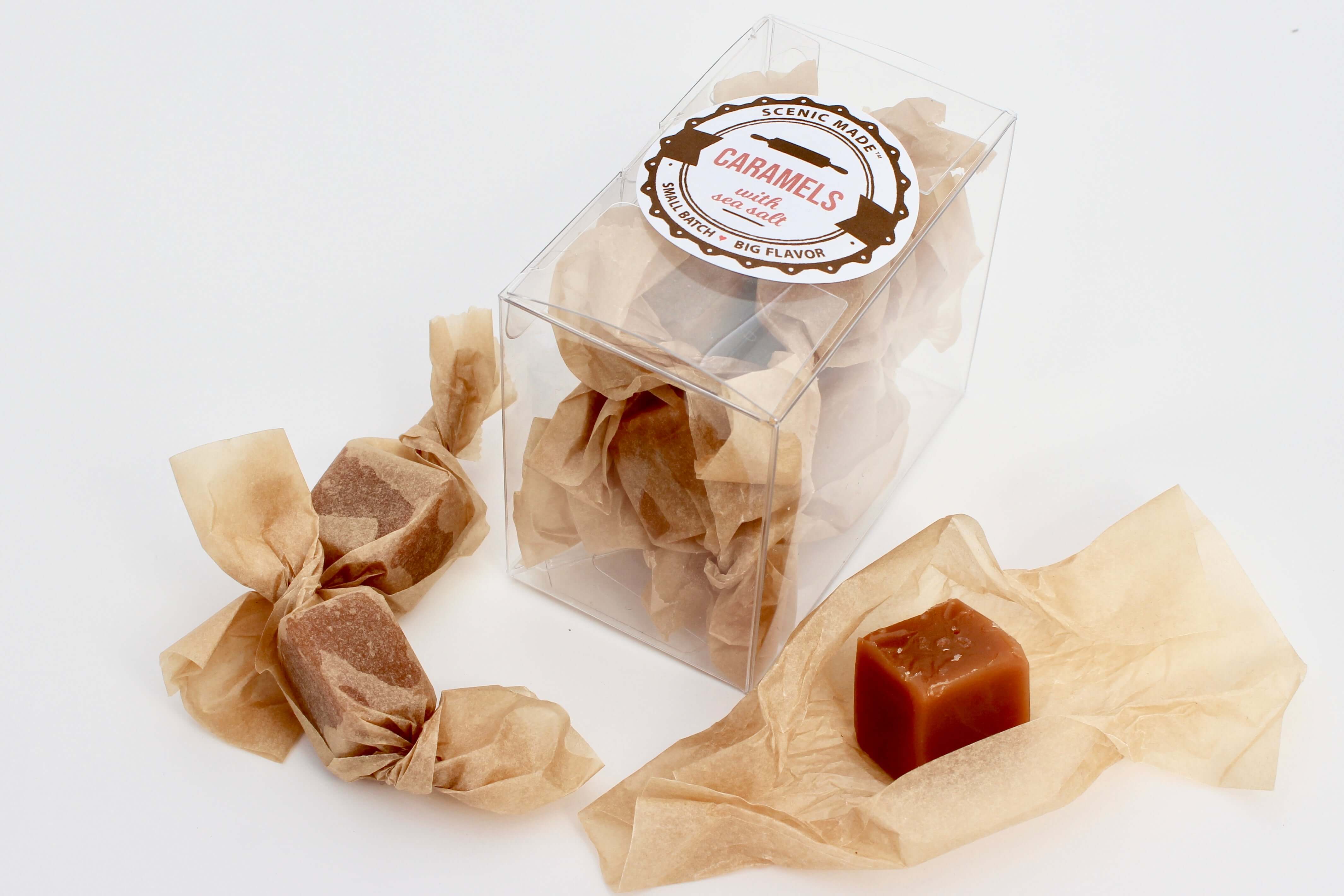 Homemade caramels, individually wrapped with unbleached parchment paper.  8 caramels are packed into a clear, rectangular food safe container with an attractive label on the front.