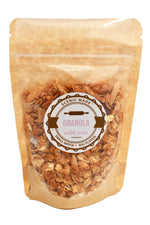 Our delicious, crunchy granola, packed in a food safe kraft bag with a clear front, labeled with a sticker.